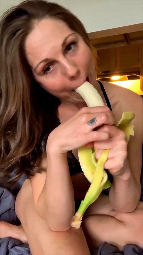 Anastasia sucks a banana