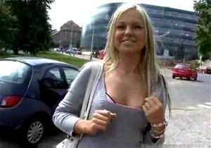 Blonde lady gives a great handjob in public