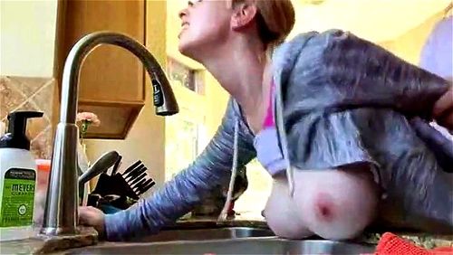 sexy housewife bent over kitchen sink