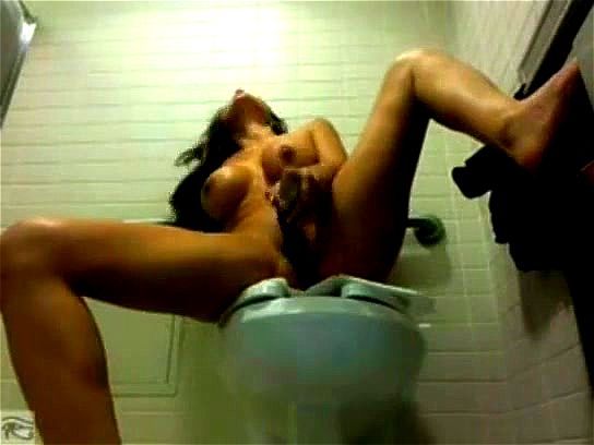 Busty brunette LatinaSugar masturbates in public toilet
