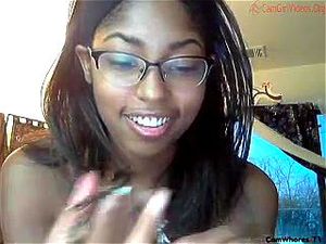Nerdy black-skinned chick presents a blowjob and gets facialized